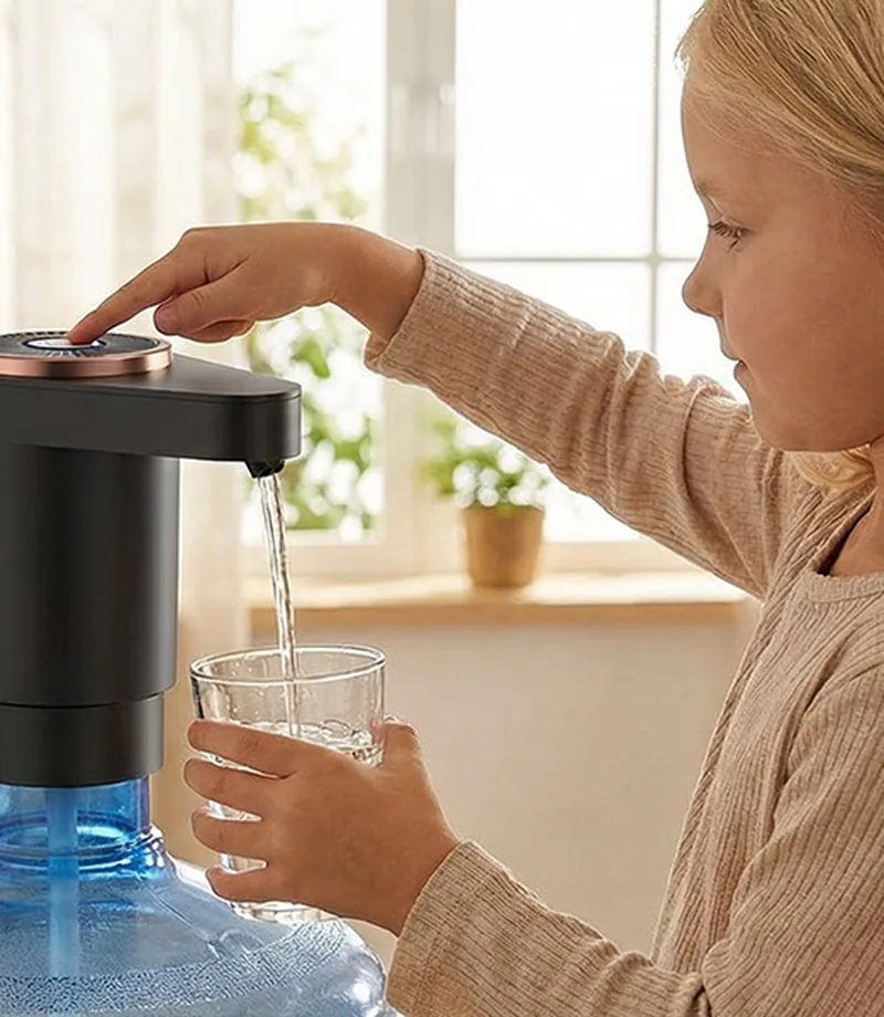 AquaLift Pro pump on water gallon in a home kitchen
